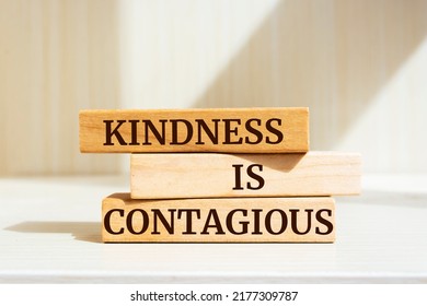 Wooden blocks with words 'Kindness is contagious'.