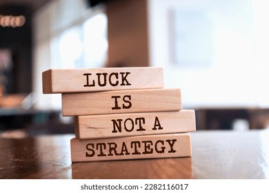Wooden blocks with words 'Luck is Not a Strategy'. - Shutterstock ID 2282116017