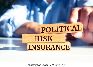 Wooden blocks with words 'Political Risk Insurance'.