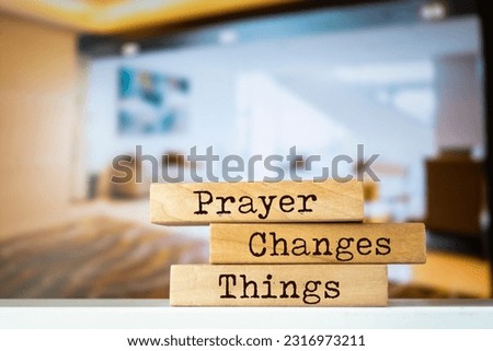Wooden blocks with words 'Prayer Changes Things'.