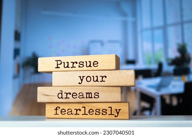 Wooden blocks with words ' Pursue your dreams fearlessly '.