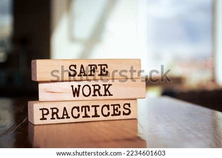 Wooden blocks with words 'Safe work practices'.