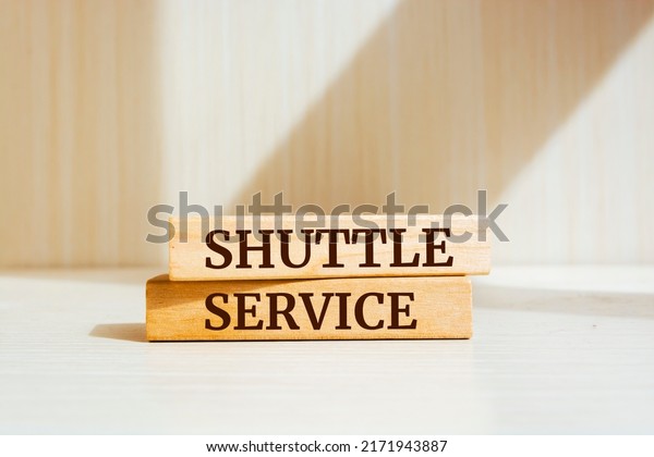 Wooden blocks with words \'shuttle service\'.\
Business concept