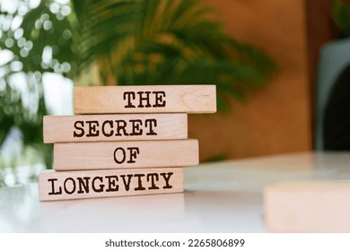 Wooden blocks with words 'The secret of longevity'.