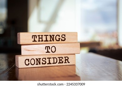 Wooden blocks with words 'THINGS TO CONSIDER'. - Shutterstock ID 2245337009