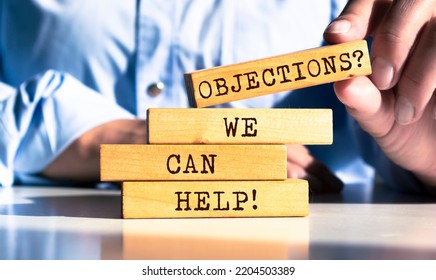 Wooden blocks with words 'Objections? We Can Help!'. - Shutterstock ID 2204503389