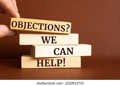 Wooden blocks with words 'Objections? We Can Help!'. - Shutterstock ID 2210912715
