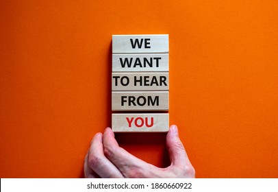 Wooden Blocks With Words 'we Want To Hear From You'. Male Hand. Beautiful Orange Background. Copy Space. Business And Support Concept.