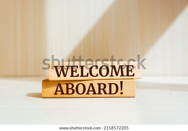 Wooden blocks with
words 'Welcome aboard'.