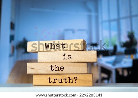 Wooden blocks with words 'What is the truth?'. Business concept