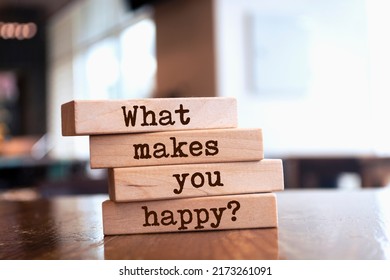 Wooden blocks with words 'What makes you happy?'. - Shutterstock ID 2173261091