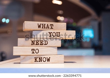 Wooden blocks with words 'What you need to know'.