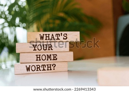 Wooden blocks with words 'What's your home worth?'.