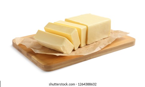 Wooden board with cut block of butter on white background