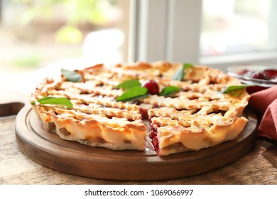 Wooden Board With Delicious Cherry Pie On Window Sill