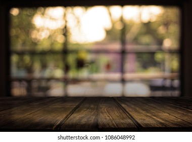 Wooden board empty table  cafe, coffee shop, bar blurred background can be used for display or montage your products and Mock up - Shutterstock ID 1086048992