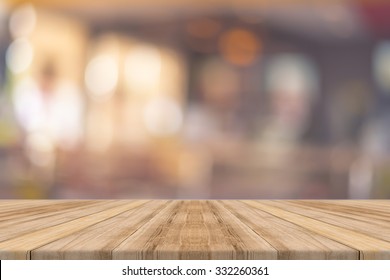Wooden board empty table in front of blurred background. Perspective brown wood over blur in restaurant - can be used for display or montage your products.Mock up for display of product. - Shutterstock ID 332260361