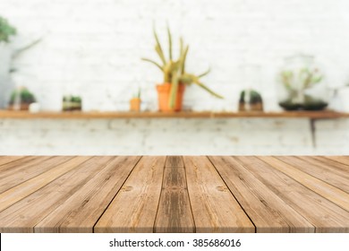 Wooden Board Empty Table In Front Of Blurred Background. Perspective Brown Wood Over Blur In Coffee Shop - Can Be Used For Display Or Montage Your Products.Mock Up For Display Of Product.