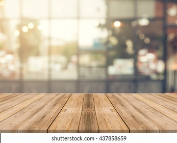 Wooden board empty table in front of blurred background. Perspective brown wood over blur in coffee shop - can be used for display or montage your products.Mock up for display of product. - Shutterstock ID 437858659