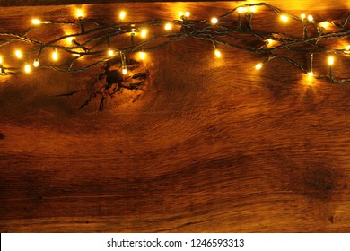 wooden board with fairy lights as a background - Powered by Shutterstock