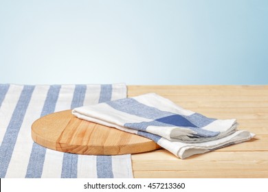 Wooden board with a napkin on a table