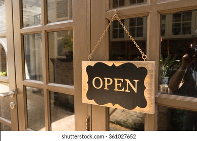 Wooden Board Sign That Says Open From A Restaurant