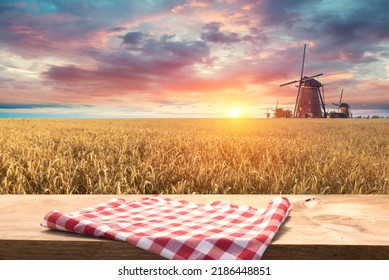 wooden board table in front of wheat field on sunset light. Ready for product display montages - Shutterstock ID 2186448851