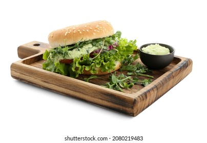 Wooden Board With Tasty Vegetarian Burger And Sauce On White Background