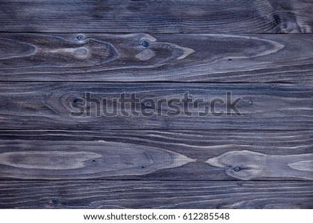 Wooden board texture with a blue tint, background and wallpaper, close up