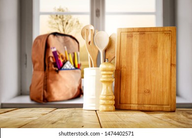 Wooden Board And Window Background With School And Kitchen Accessories.