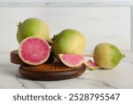 Wooden boards with ripe watermelon radishes on white background