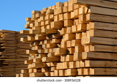 wooden boards stacked at the timber yard - Shutterstock ID 308936528