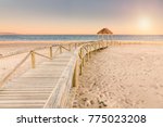 Wooden boardwalk to the beach. Idyllic scene in Trafalgar coast, Cadiz, Spain.