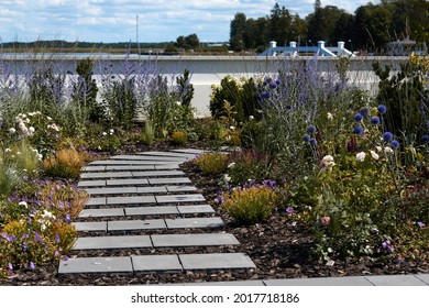 Wooden Boardwalk In The Green Garden. High Quality Photo