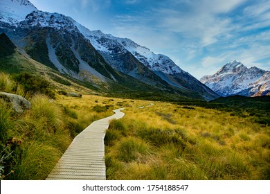 The wooden boardwalk providing the pathway through Hooker Valley Track in Aoraki Mt Cook National park towards NZ highest mountain in the Southern Alps - Powered by Shutterstock