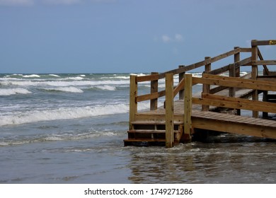 Wooden boardwalk steps give walkover access to beach. - Shutterstock ID 1749271286