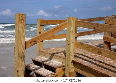 Wooden boardwalk steps give walkover access to beach. - Shutterstock ID 1749271316