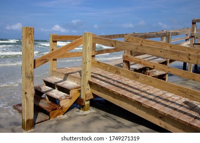 Wooden boardwalk steps give walkover access to beach. - Shutterstock ID 1749271319
