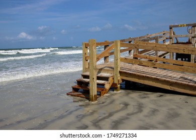 Wooden boardwalk steps give walkover access to beach. - Shutterstock ID 1749271334