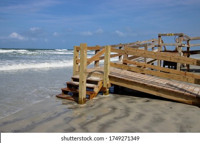 Wooden boardwalk steps give walkover access to beach. - Shutterstock ID 1749271349