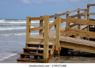 Wooden boardwalk steps give walkover access to beach. - Shutterstock ID 1749271388