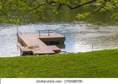 A Wooden Boat Dock On The Allegheny River On A Sunny Summer Day In Warren County, Pennsylvania, USA