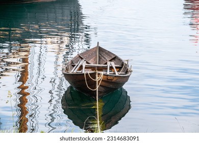 wooden boat in a peaceful landscape in the City Ålesund in Norway