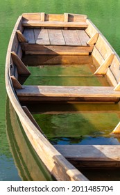 The Wooden Boat Is Sinking In The Water Of The Lake.