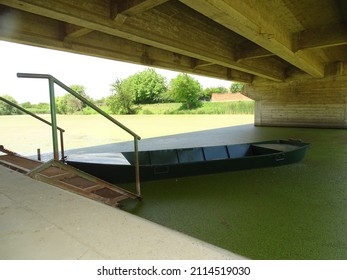 A Wooden Boat Under The Bridge