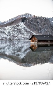 A wooden boathouse cabin in the mountain lake Almsee in Upper Austria