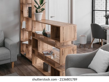Wooden bookcase in interior of modern living room