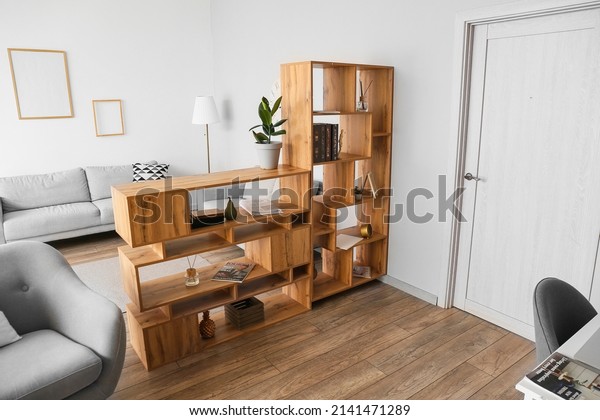 Wooden\
bookcase in interior of modern living\
room