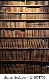 Wooden Bookshelf With Antique Books.