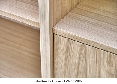 Wooden bookshelves. Wooden bookcases and wall panels made of oak veneered MDF. Close-up
